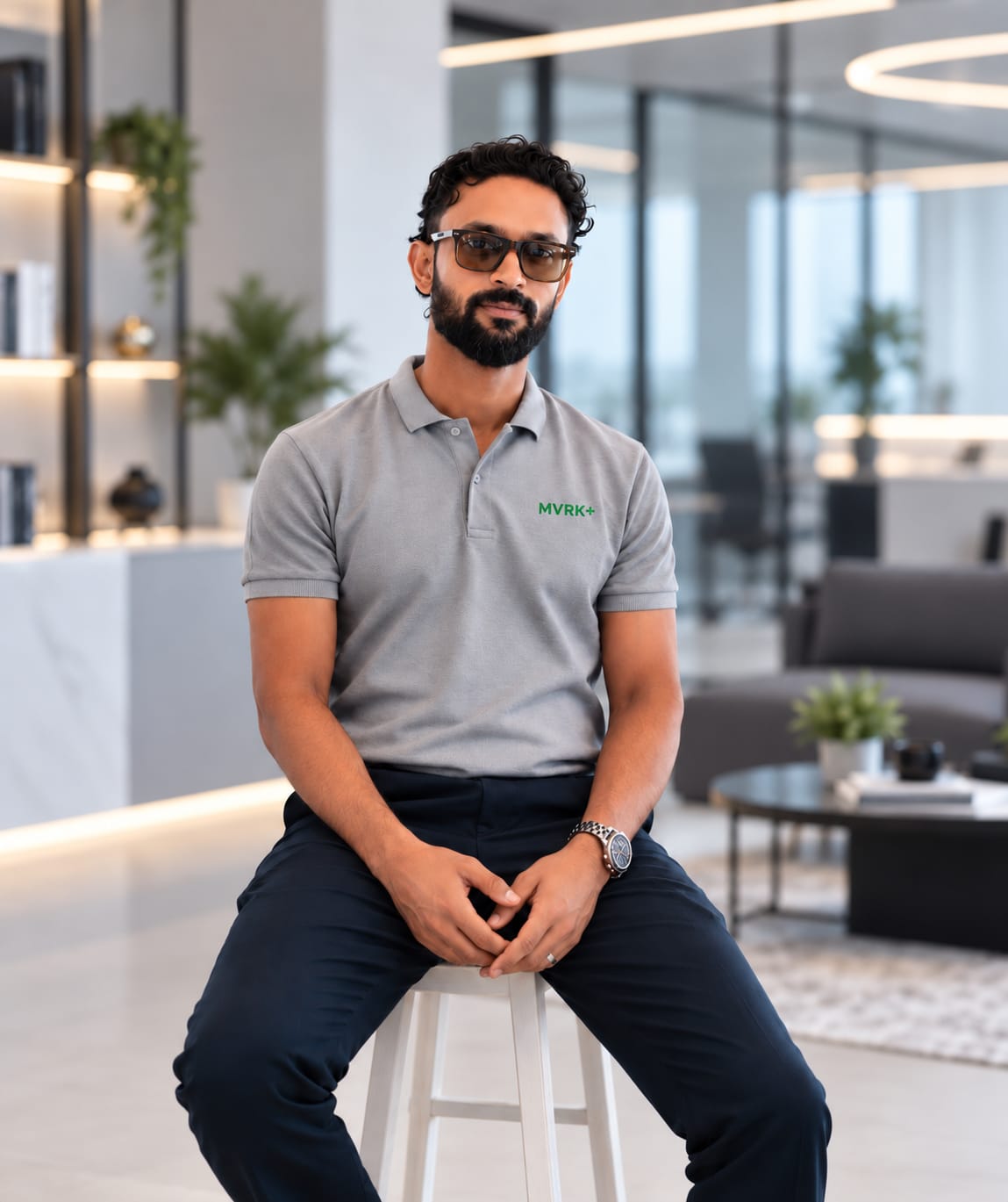 Richi Nova, Founder and Strategic Director of MVRK+, seated in a bright office wearing an MVRK+ polo